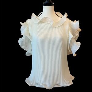 Pleated top, ruffle sleeves, good condition, sold as is, Size 38